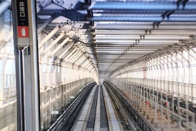 Railroad tracks seen through train windshield at subway station