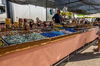 Man preparing food at market stall