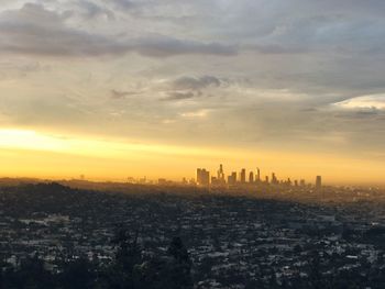 Cityscape against sky during sunset