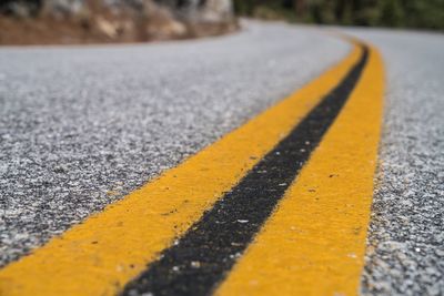 Close-up of double yellow line on road