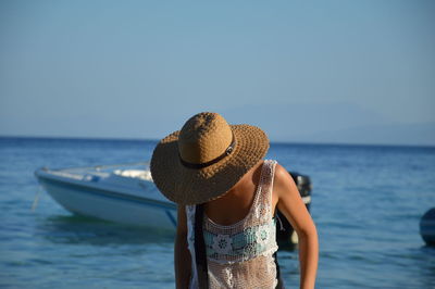 View of sea with people in background