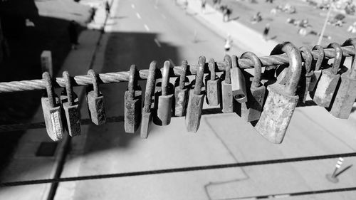 Close-up of padlocks hanging on railing