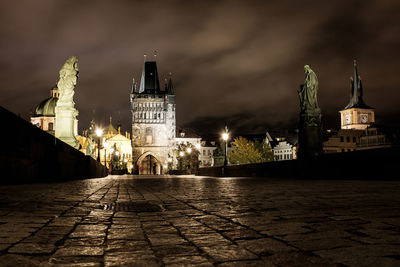 Illuminated buildings in city at night