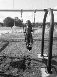 Girl on swing at playground