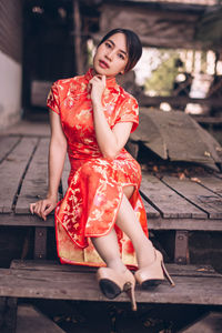 Young woman sitting on bench