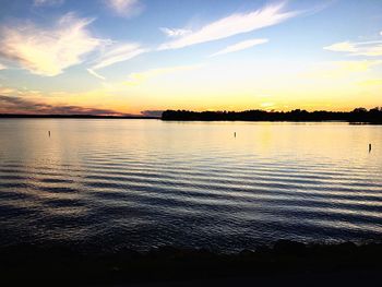 Scenic view of calm sea at sunset