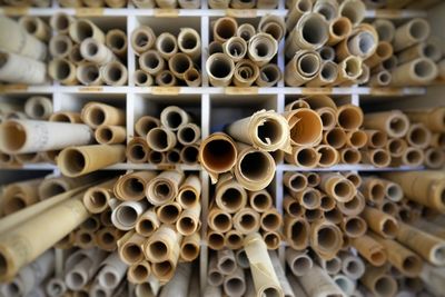Close-up of paper rolls arranged in shelf