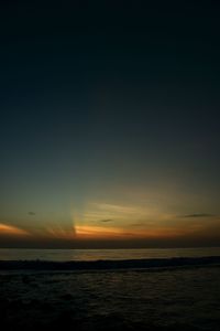 Scenic view of sea against sky at sunset