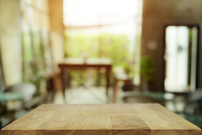 Empty chairs and table in room