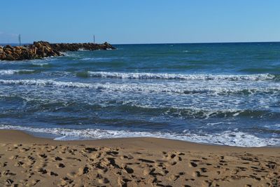 Scenic view of sea against clear sky