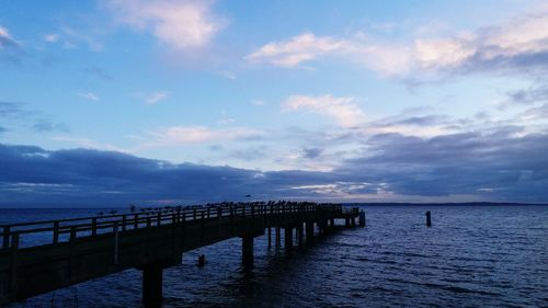 Pier over sea against sky