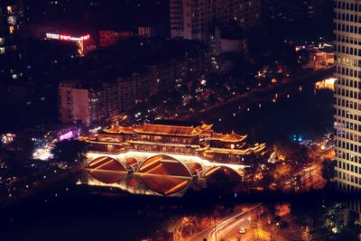 High angle view of illuminated buildings in city