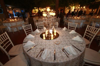 High angle view of lit candles on table at restaurant