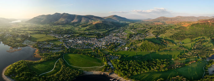High angle view of townscape and mountains against sky