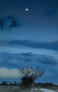 Scenic view of moon in blue sky at night