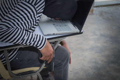 High angle view of man using mobile phone