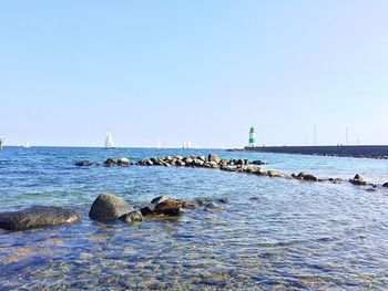 Lighthouse against sea