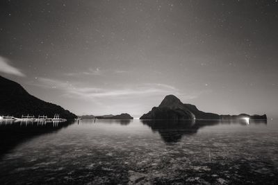 Scenic view of sea against sky at night