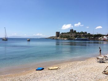 Scenic view of sea against blue sky