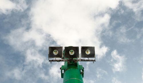 Low angle view of information sign against sky