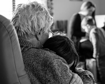 Love across generations, daughter embracing great grandmother 