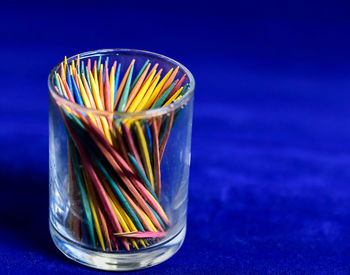 Close-up of multi colored glass on table