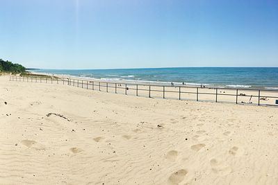 Scenic view of beach against clear sky