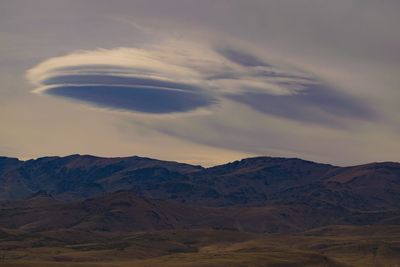 Scenic view of mountains against sky at sunset