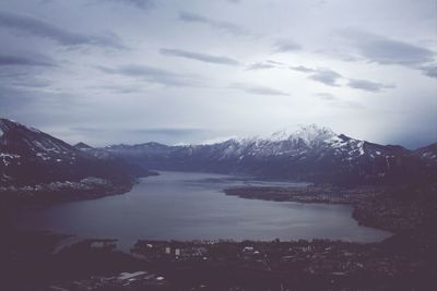 Scenic view of lake and mountains against sky