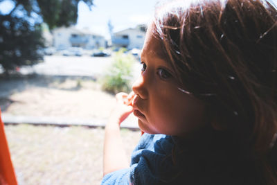 Close-up of thoughtful girl looking away