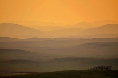 Scenic view of mountains during foggy weather