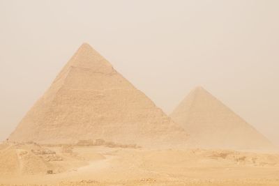 Low angle view of desert against clear sky