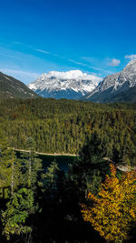 Scenic view of mountains against blue sky