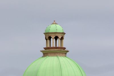 Low angle view of bell tower against sky