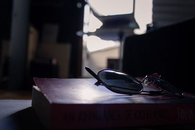 Close-up of sunglasses on table