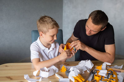 Boy playing with toy at home