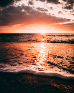 Scenic view of sea against sky during sunset