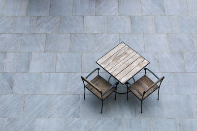 High angle view of chairs on table against building