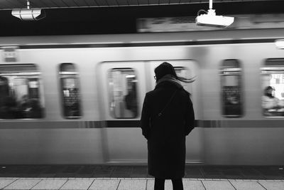 Blurred motion of train at railroad station