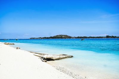 View of beach against blue sky