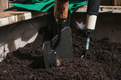 Close-up of shovel in soil