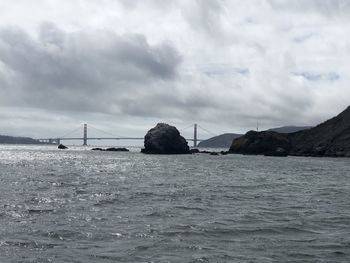 Bridge over sea against sky