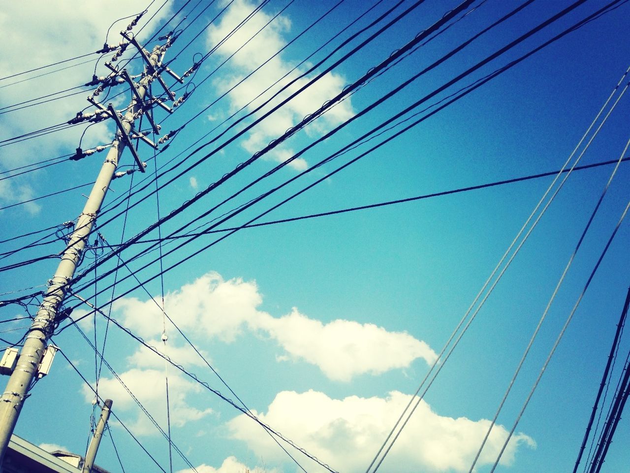 power line, electricity, cable, power supply, low angle view, electricity pylon, connection, sky, fuel and power generation, technology, power cable, blue, complexity, cloud - sky, cloud, outdoors, wire, no people, day, telephone pole