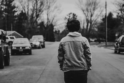 Rear view of man standing on street