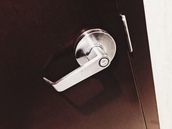 Metal door handle on a door