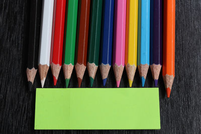 Close-up of multi colored pencils on table