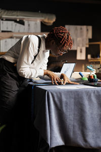 Woman using laptop at home