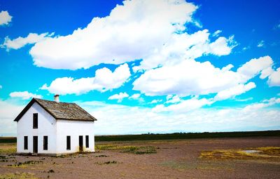 House on field against sky