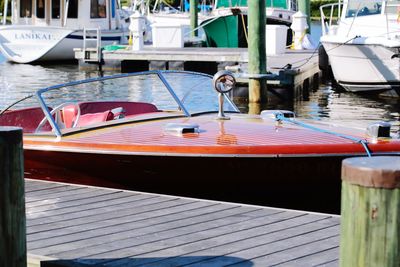 Close-up of boats moored at harbor