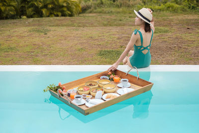 Side view of woman in swimming pool